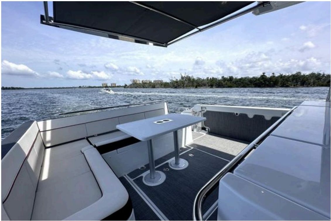 Aft cockpit with table and electric sunshade