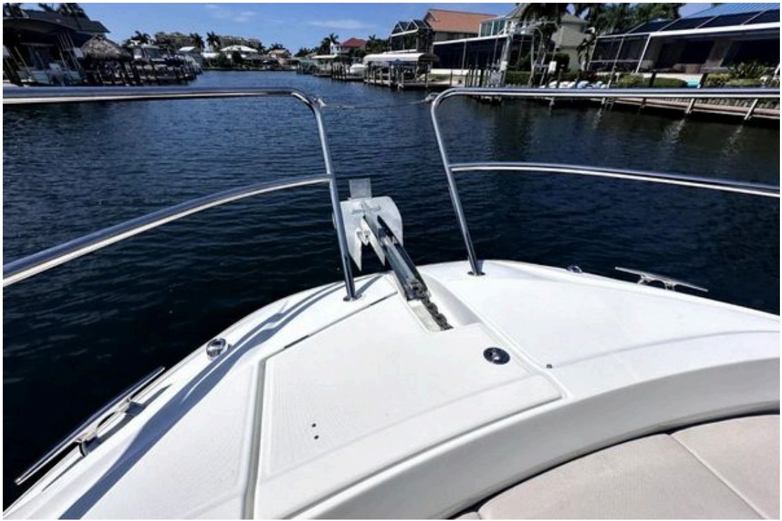Leader 12.5 WA bow moving through a residential canal