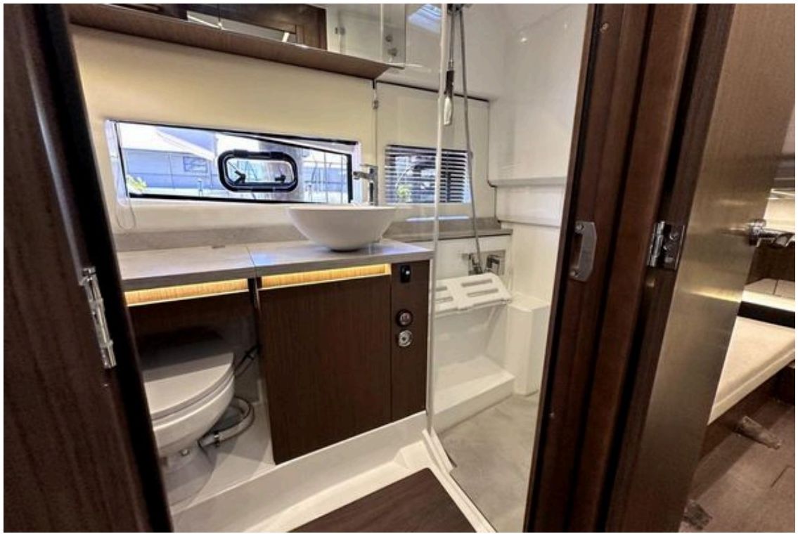 Head with toilet, sink, and shower